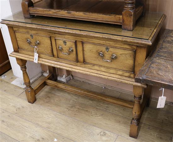 A small reproduction three drawer dresser base W.106.5cm